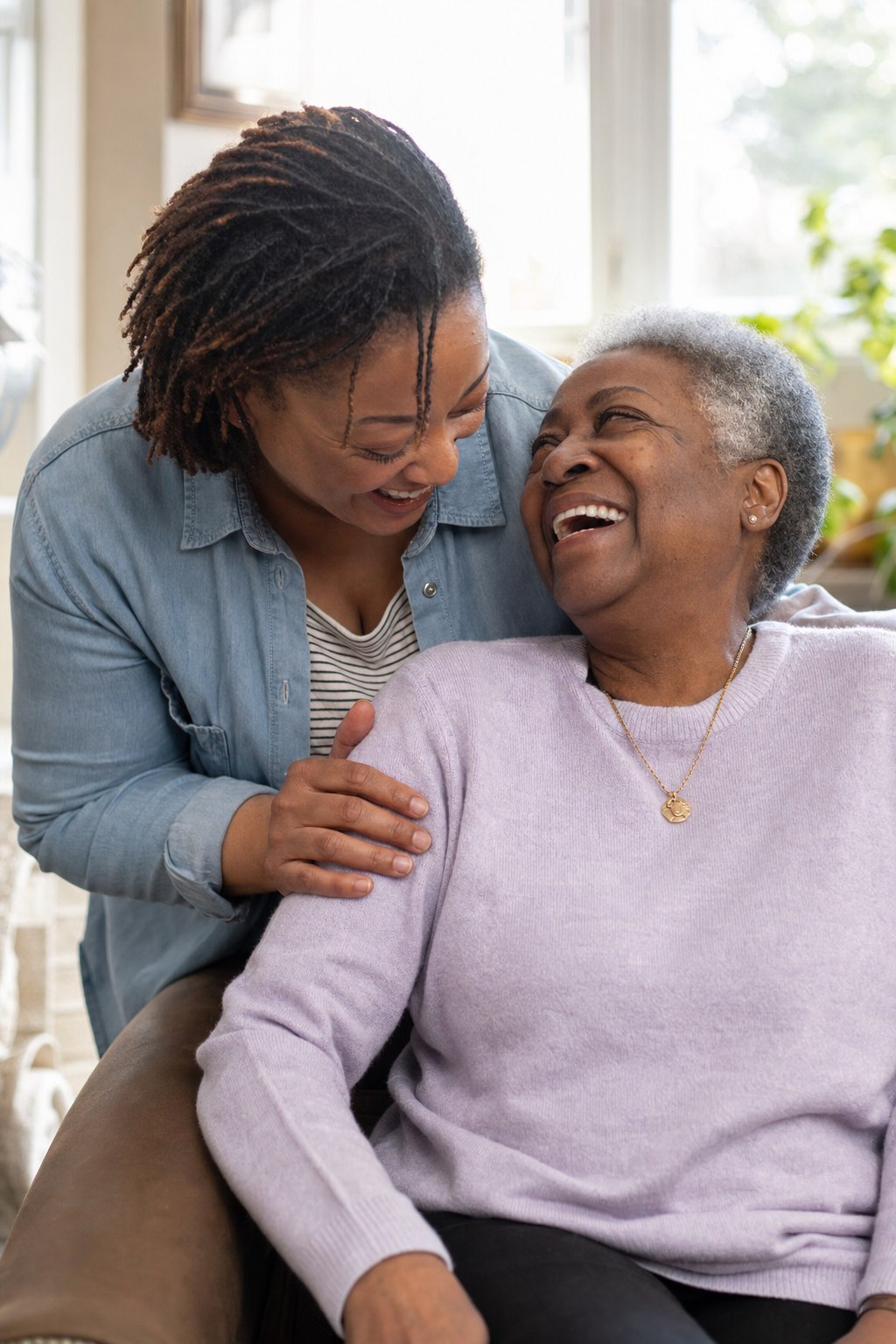 A case manager and client review a care plan together at a bright office table.